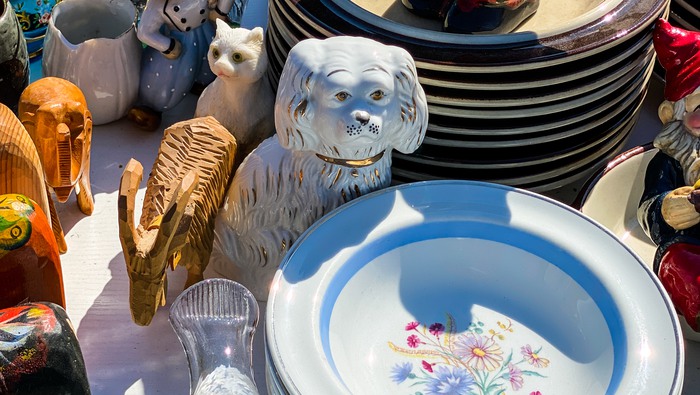 Retro tableware and porcelain figurines for sale on flea market, garage sale or trunk show. Second hand.